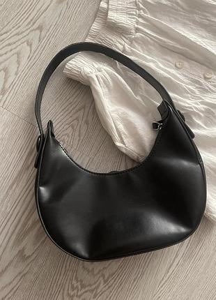 Клатчі чорного і коричневого кольору