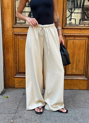 Жіночі бежеві брючні штани