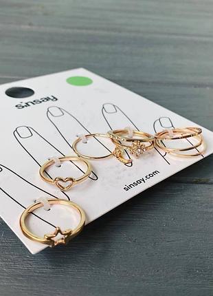 Кільця золотисті sinsay, сердечко, зірочка, камінці