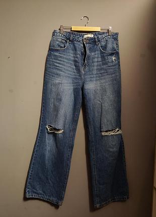 Джинсы потертые