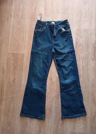 Джинсы клеш