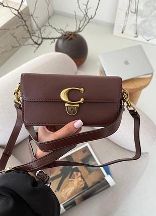 Сумка в коричневому кольорі coach