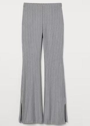 Серые высокие женские брюки клеш с разрезами