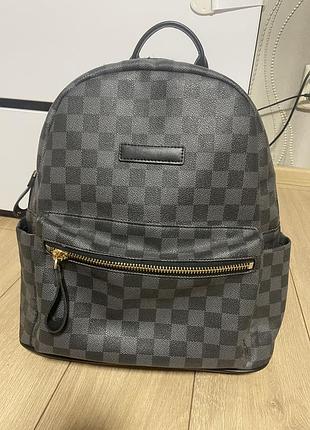 Рюкзак і клітинку