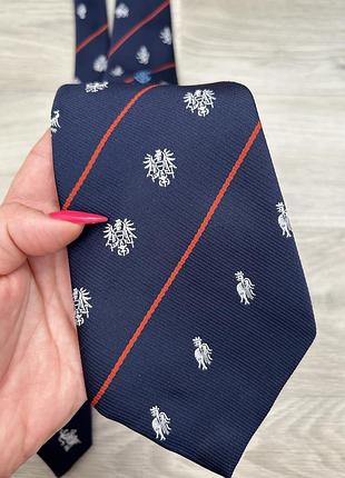 Галстук синий винтаж с гербом и оранжевой полоской