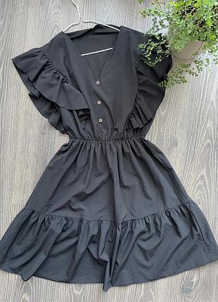 Стильне жіноче плаття чорного кольору з резинкою на поясі