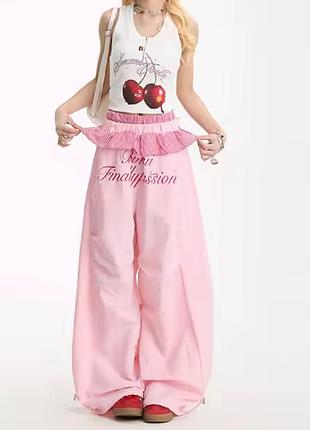 Рожеві широкі оверсайз повсякденні штани з плащівки