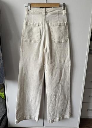 Джинси молочного кольору