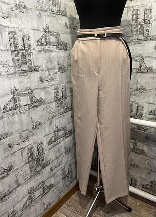 Бежеві в полоску кльош палацо брюки