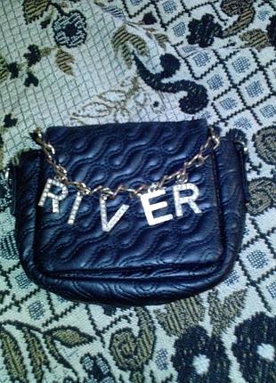 Маленька жіноча сумочка