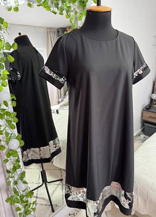 Черное платье трапеция с декором из сетки с вышивкой