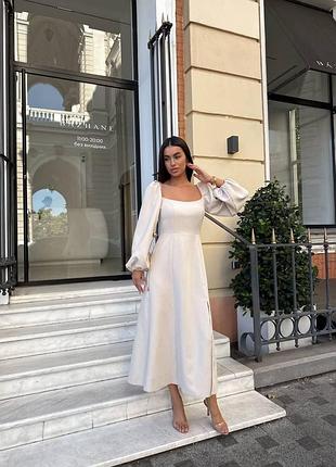 Неймовірна сукня міді з розрізом на нозі та рукавами ліхтариками