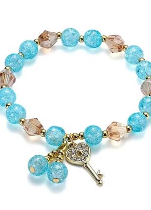 Браслет с бусинами ключиком