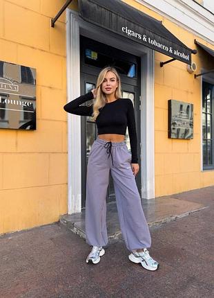 Спортивні оверсайз штани джоггерами з кишенями з принтом написом з резинкою знизу