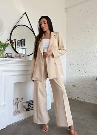 Розкішний класичний костюм піджак без підкладки з плечиками та штани палаццо вільного крою позаду на резинці