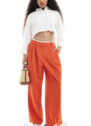 Помаранчеві широкі штани розмір м-l від бренду river island