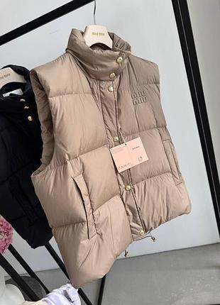 Женская жилетка