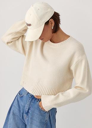 Укорочена в’язана кофта зі рваним ефектом