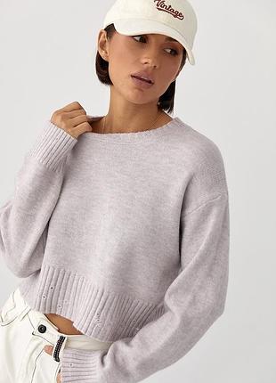 Укорочена в’язана кофта зі рваним ефектом