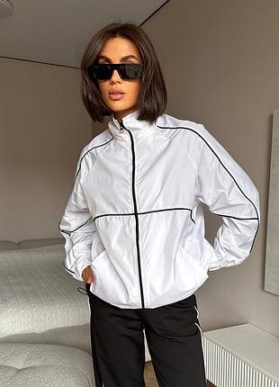 Стильна жіноча вітровка оверсайз із кантами на блискавці з резинкою по низу