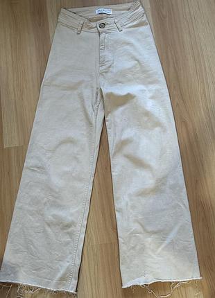 Бежеві джинси з необробленим низом від primark denim co.