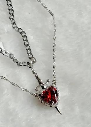 Парні ланцюжки з кулонами меч і серце