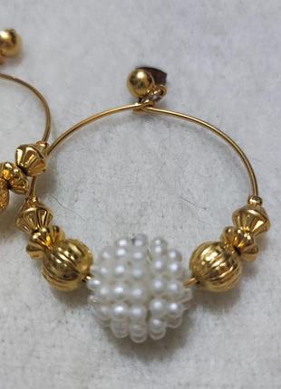 Сережки з пластикових та металевих намистин