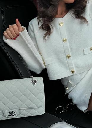 Жіночий костюм з міні спідницею і укороченою кофтою на ґудзиках з ангори