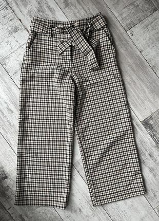 Укорочені брюки в клітинку