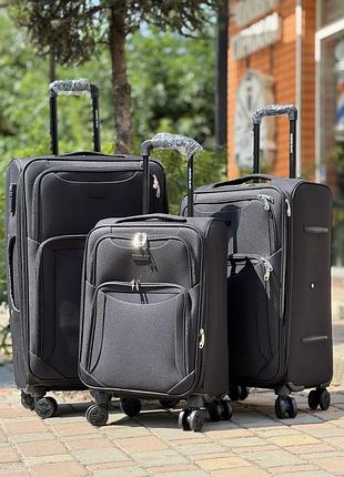 Большой чемодан дорожный тканевый l польша на колесах gloria с подшипником