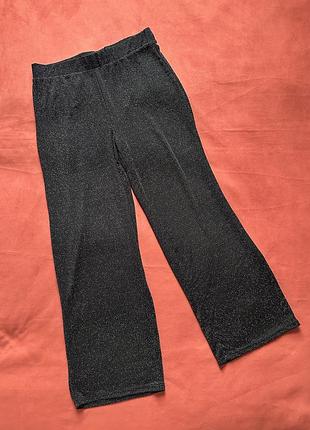 Шикарні блискучі сяючі штани палаццо