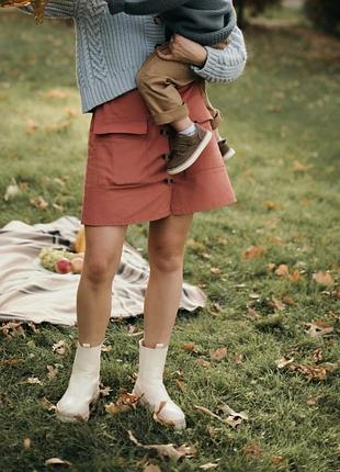 Спідниця трапеція цегляного кольору з акцентними кишенями