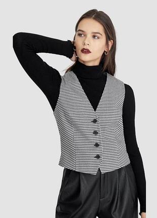 Жилет у клітинку