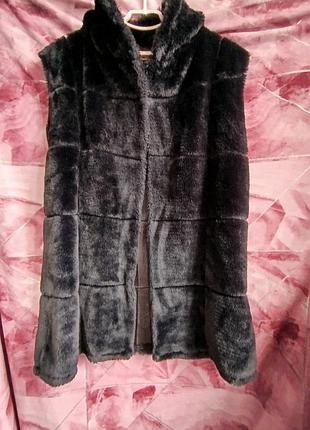 Жилет, безрукавка