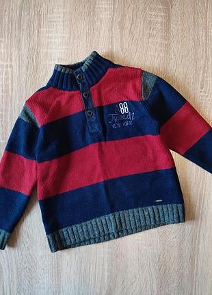 Дитячий в'язаний светр у смужку з коміром стійкою