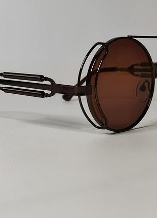 Круглые солнцезащитные очки в дизайне пружины