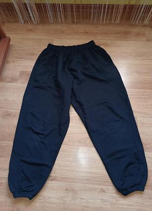 Синие теплые брюки женские