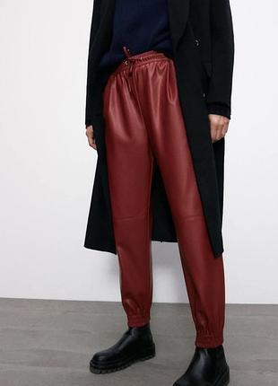Штани еко шкіра джогери бургунді на шнурках