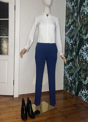 Класичні бавовняні сині завужені брюки для офісу з карманами