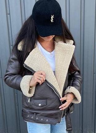 Коричнева жіноча тепла куртка дублянка з хутром подовжена