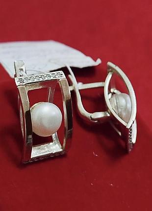Срібні сережки з перлиною та вставками золота.