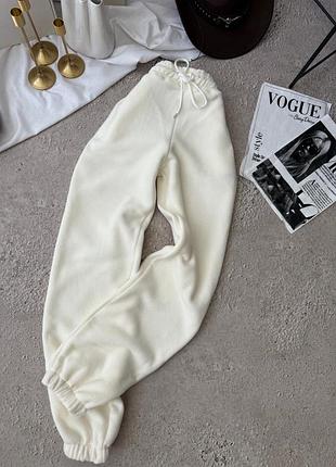 Зручні жіночі штани флісові джогери вільного крою на резинках зі шнурком на поясі з середньою посадкою