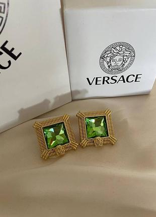 Брендові сережки в позолоті з великими зеленими каменями