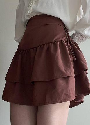Міні-спідниця зі шнурівкою по боках