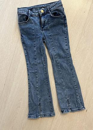 Стильні дитячі джинси клеш з розрізами