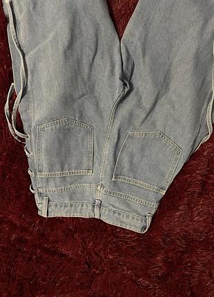 Джинси з шнурками по бокам