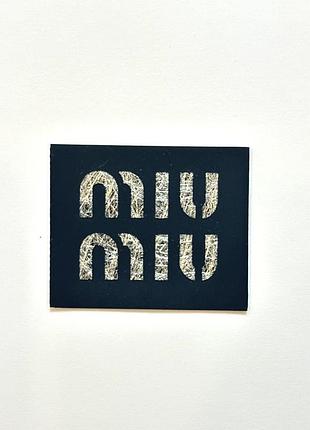 Лейба гумова 5*4см на клейовій основі колір чорний логотип