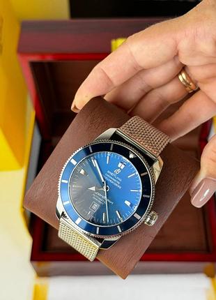 Годинник наручний круглий, сині сріблясті