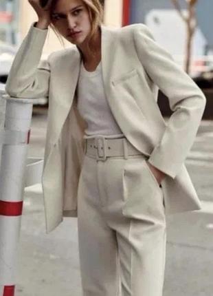 Брюки з поясом високої посадки