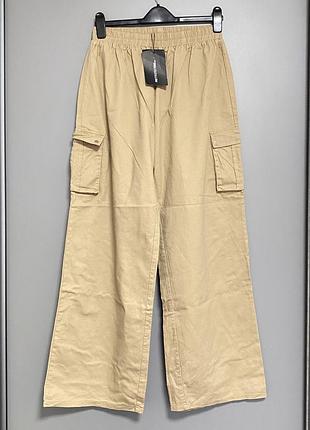 Широкі штани з накладними кишенями по боку